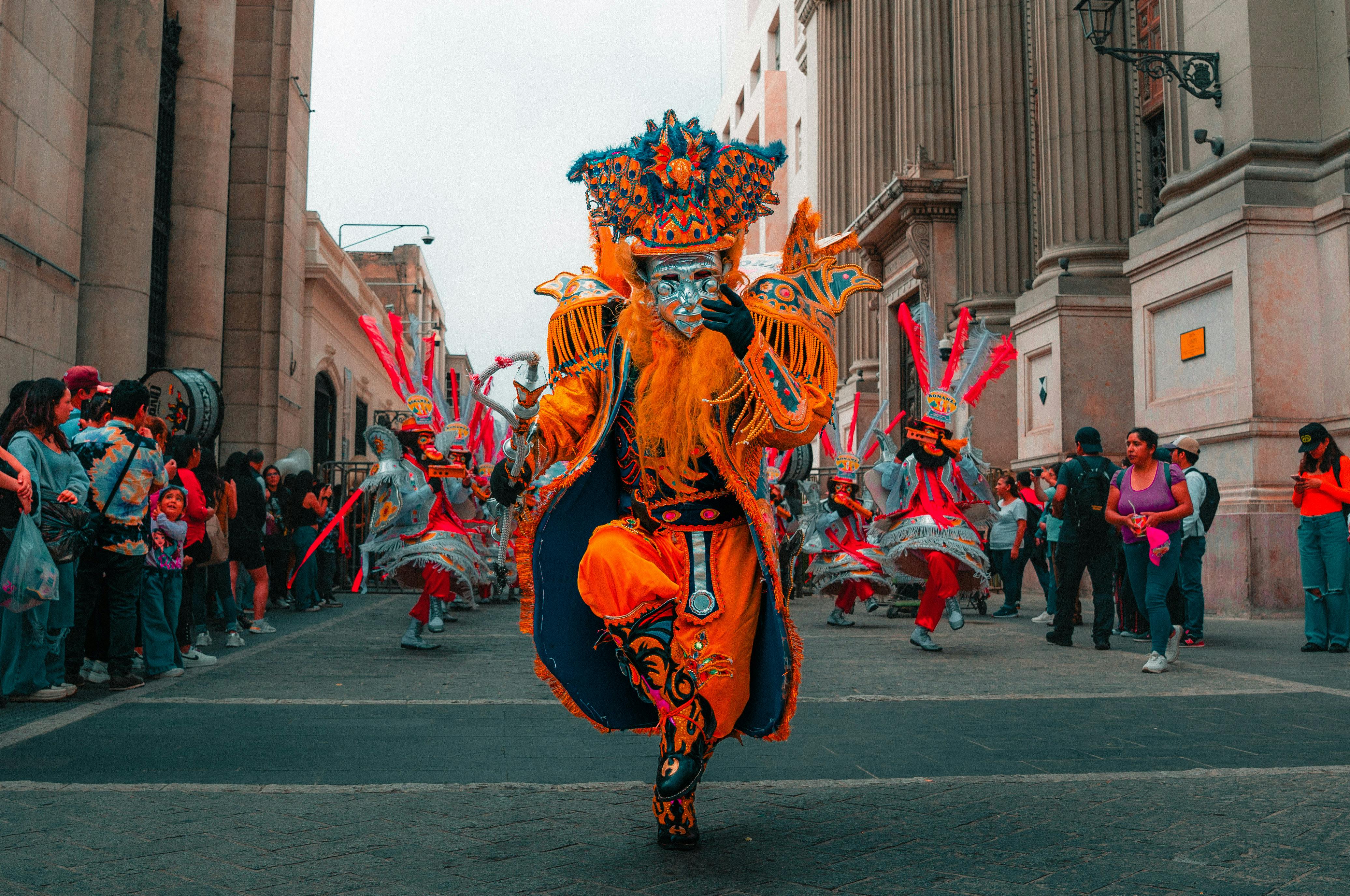 Man in Traditional Clothing Walking Through Peru Street